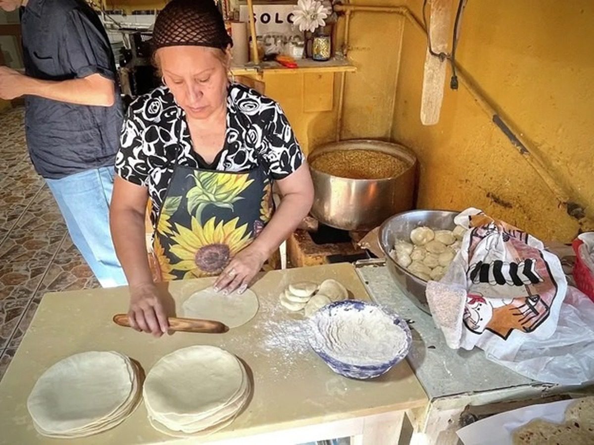 Woman making fresh tortillas at The Tortilleria Factory in McAllen, TX