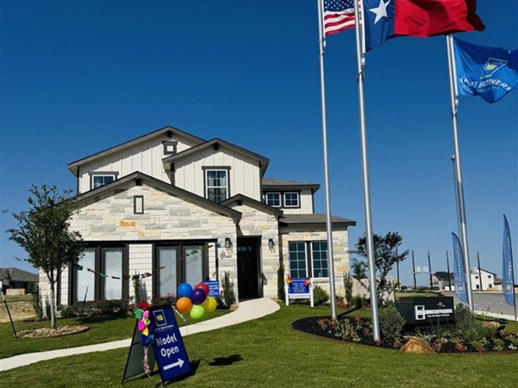 Bandera model home in Hickory Ridge community in San Antonio, Texas decorated for Fiesta with colorful balloons and flags outside