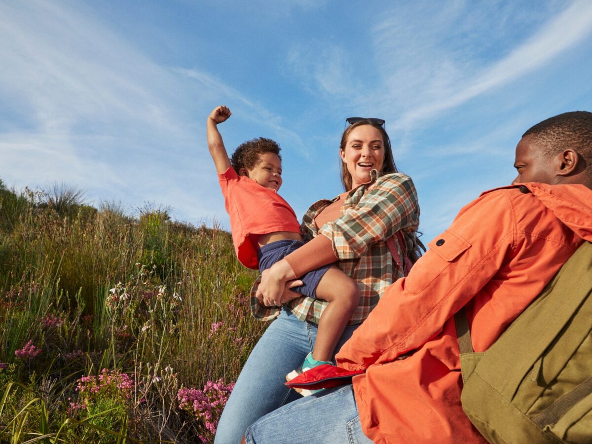 Young family laughing on scenic hike