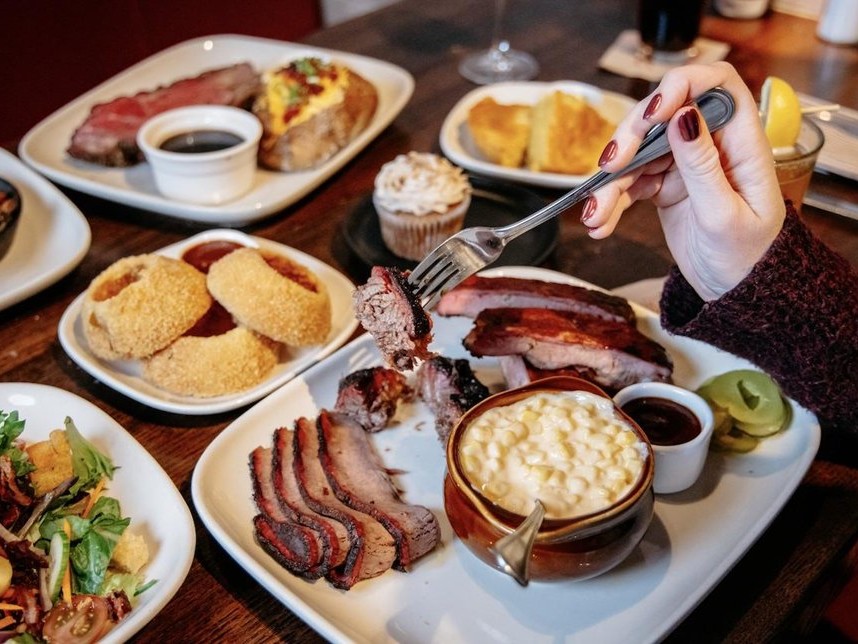 Table full of barbecue dishes from Jack Stack in Kansas City