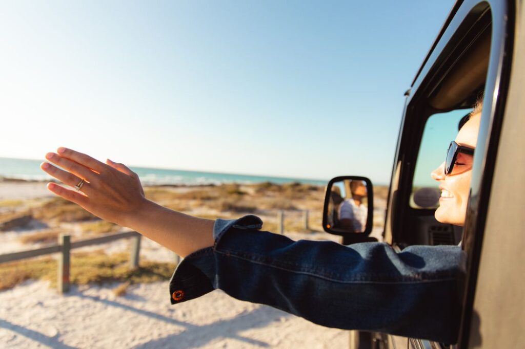 Woman in a car at the beach