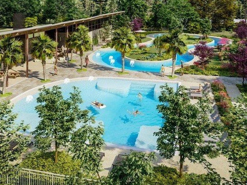 Aerial view of a community pool and lazy river at Metro Verde Arcadia community by Hakes Brothers