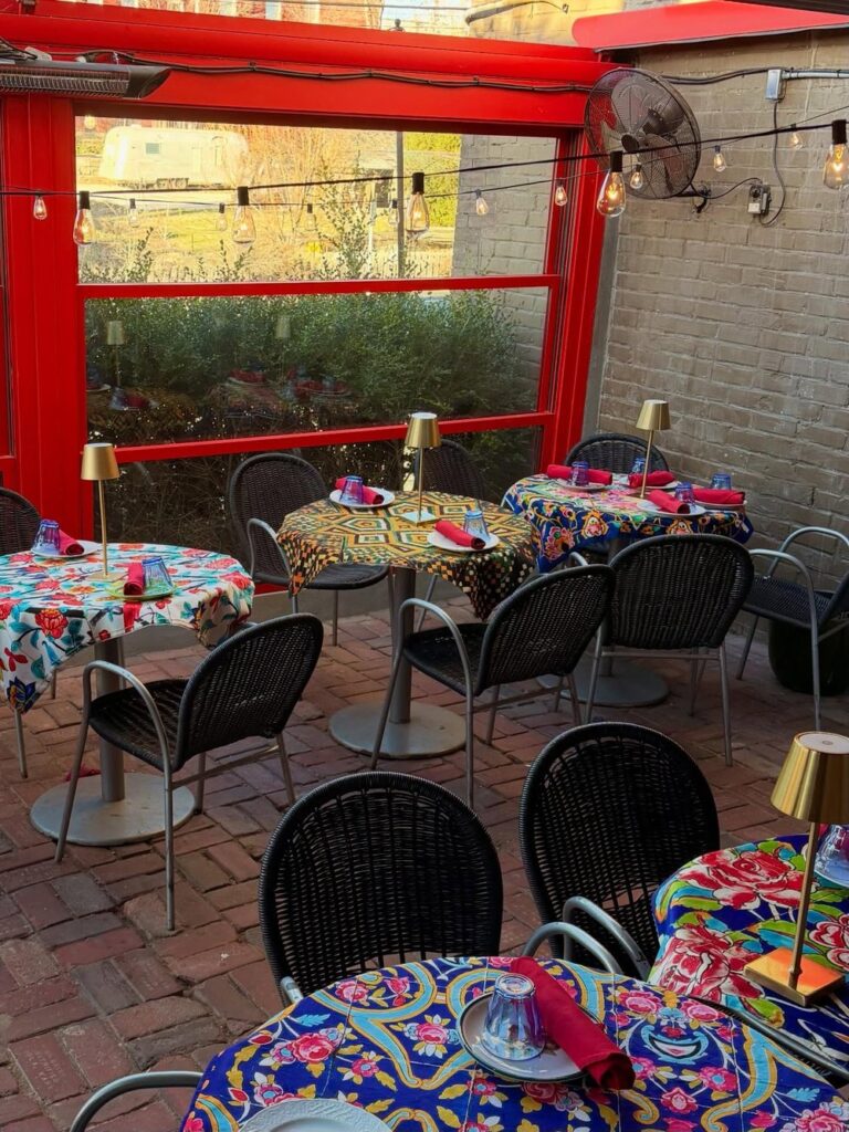 Colorful outdoor dining area at Clay and Fire in Kansas City