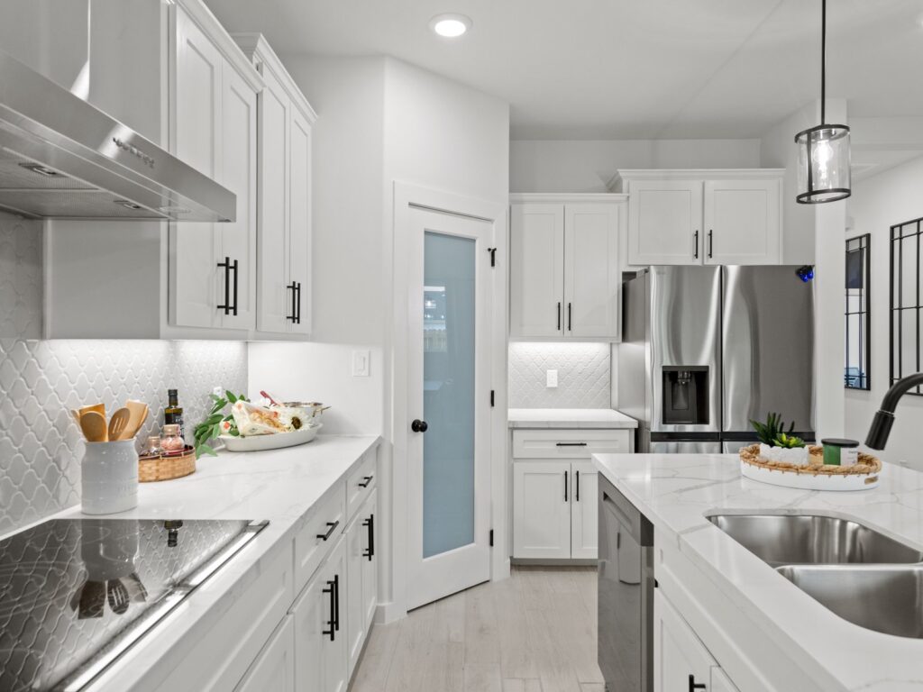 Beautiful model home kitchen interior by Hakes Brothers