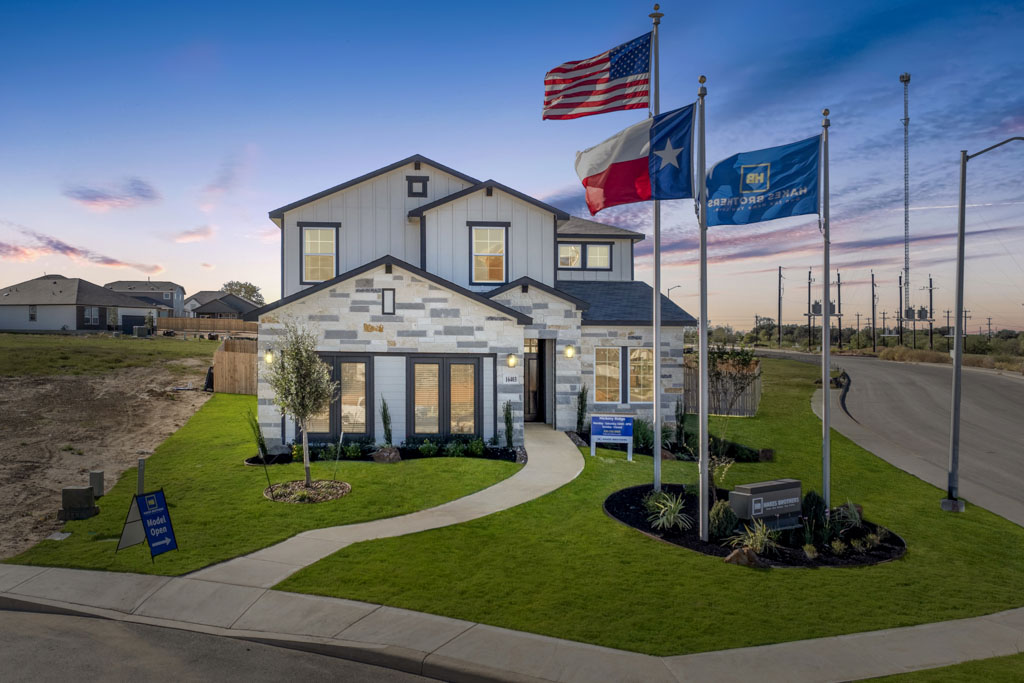 Hakes Brothers model home exterior at sunset.