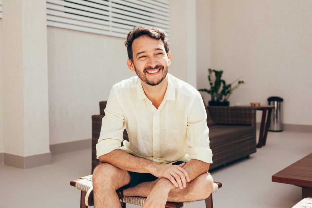 Smiling adult man in a bright living room in Las Cruces, NM