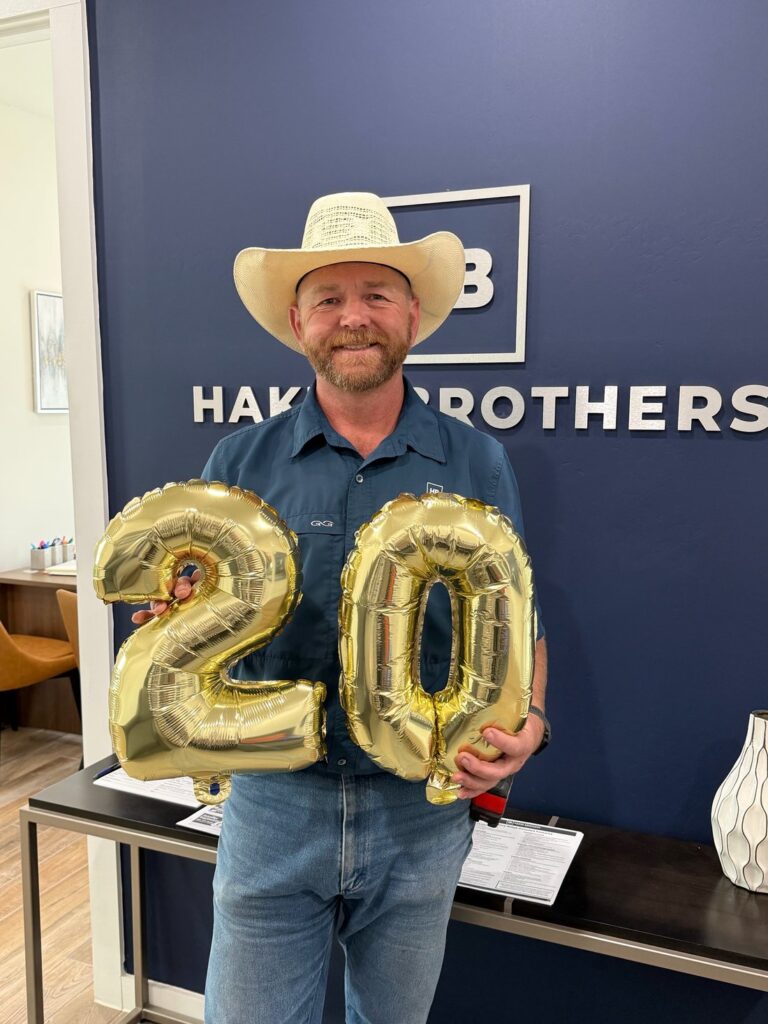 Hakes Brothers AvidCX award-winner Jacob Horton holding celebratory balloons.