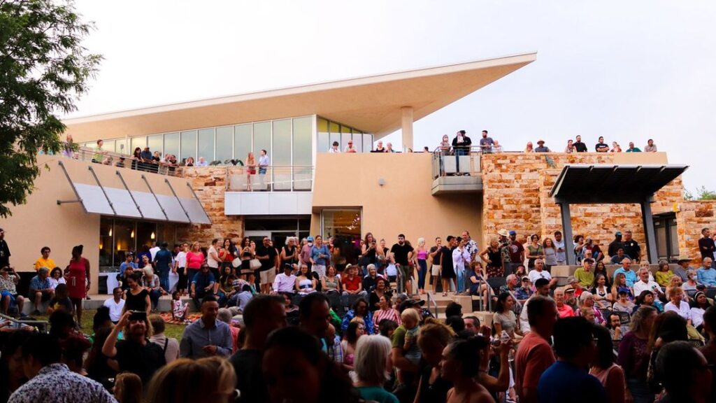 Exterior of Albuquerque Museum during an event with many attendees