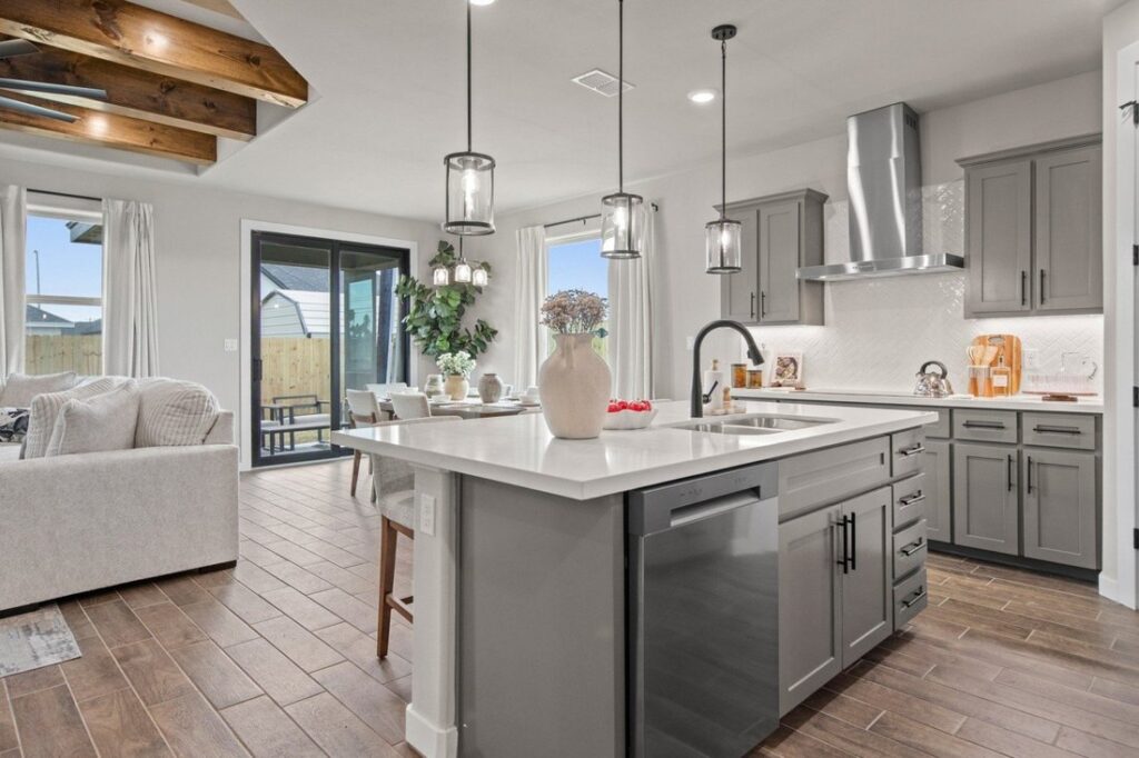Interior of a Hakes Brothers model home kitchen and living room.